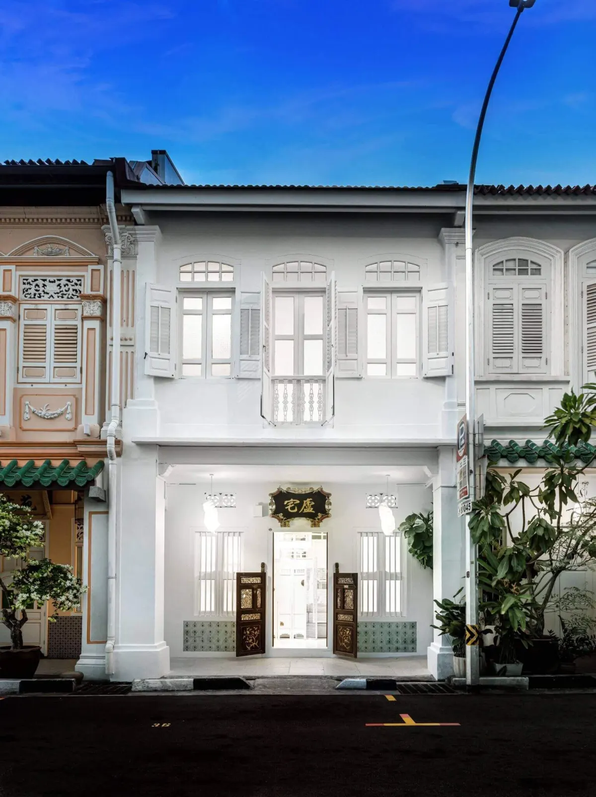 A restored conserved shophouse on Blair Road with its doors open