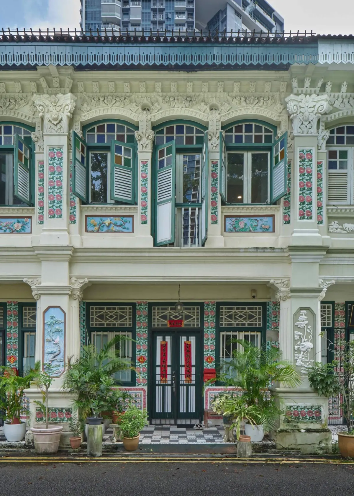 Ornate conserved shophouse facade and five-foot way at Petain Road